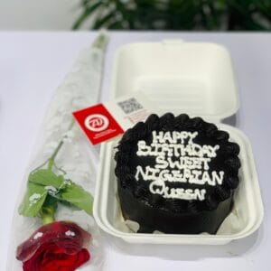 A delicious bento cake paired with a fresh rose, beautifully packaged for delivery.